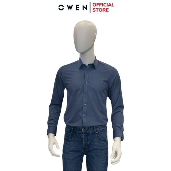 Áo Sơ Mi Nam Tay Dài Owen AR240610D màu xanh đậm trơn dáng suông regular fit tà lượn không túi chất liệu polyester