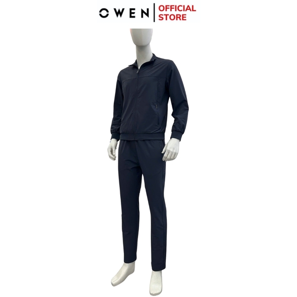 Bộ Thể Thao Nam Owen BTT256157 màu xanh tím than dáng reguler, áo cổ 3 phân, khóa kéo, tay và gấu bo chun, quần cạp chun ống suông chất liệu polyester