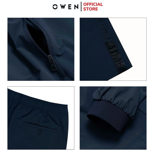 Bộ Thể Thao Nam Owen BTT256157 màu xanh tím than dáng reguler, áo cổ 3 phân, khóa kéo, tay và gấu bo chun, quần cạp chun ống suông chất liệu polyester