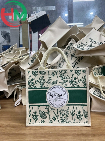 tui-vai-linen-in-logo-mon-amie-qua-tang-dong-hanh-cung-vest-cao-cap