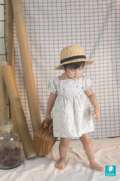 Váy bé gái - Váy thô tay bồng cúc ngực chấm bi