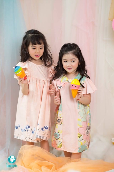 Váy thô cổ nơ pha hoa 2 bên chữ T cam nhạt-TBOW1