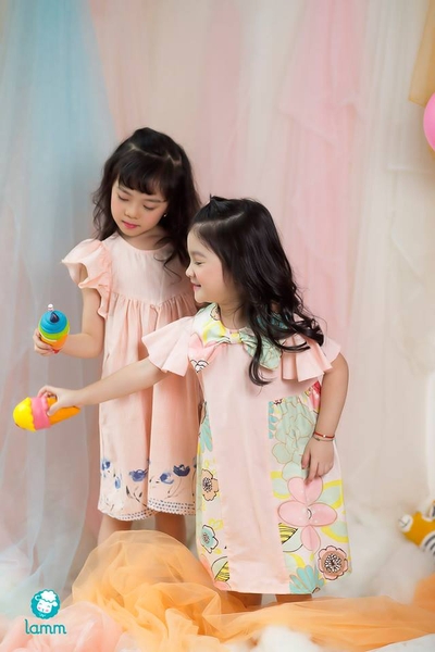 Váy thô cổ nơ pha hoa 2 bên chữ T cam nhạt-TBOW1