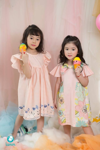 Váy thô cổ nơ pha hoa 2 bên chữ T cam nhạt-TBOW1