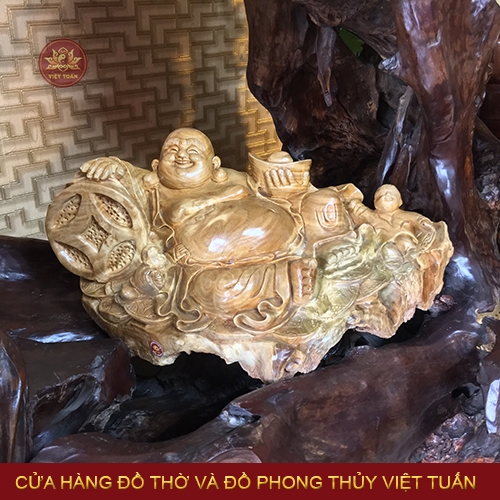 Tượng Di Lạc cầm nén vàng