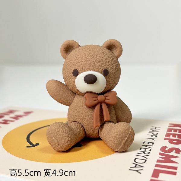 Tượng gấu nâu đậm - cài nơ màu nâu.