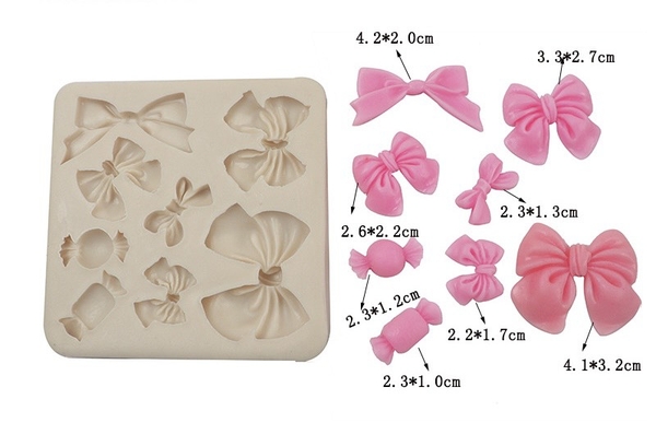 Khuôn silicon-6 nơ to nhỏ và 2 kẹo.