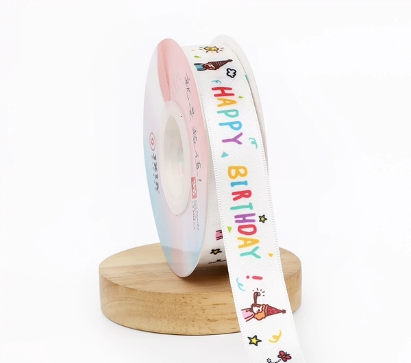 Ruybang hoạt hình 2.5cm x 25m- chữ HPBD sắc màu và em bé đội mũ.