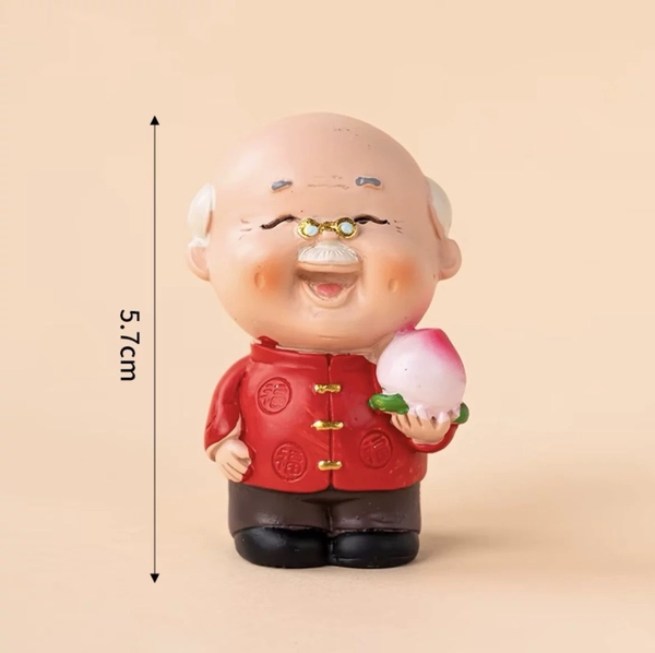 Tượng sứ -ÔNG cầm đào tiên.