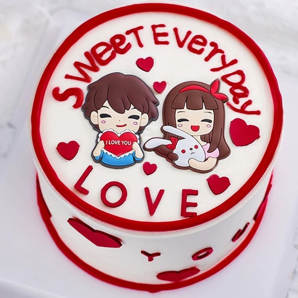 Tượng nhựa dẻo-bé trai ôm trái tim chữ i love you.