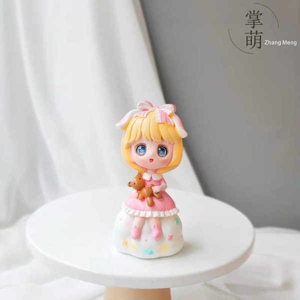 TUONG-Búp bê ngồi váy hồng