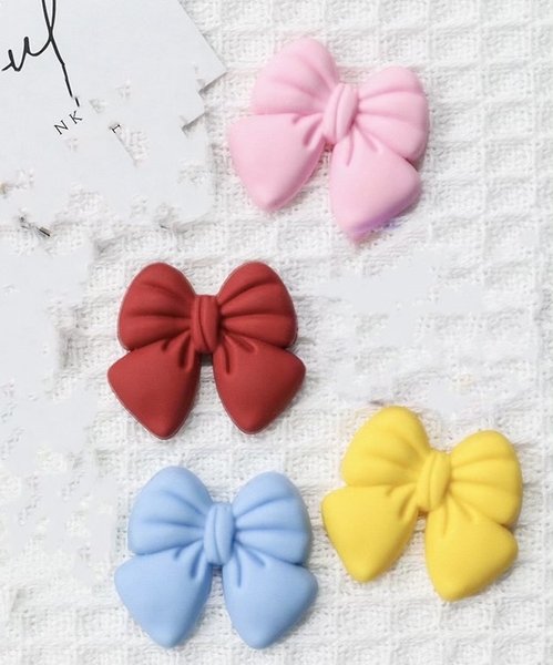 Set 10 nơ nhựa dẻo mix màu kt3.1cm x 3.5cm.