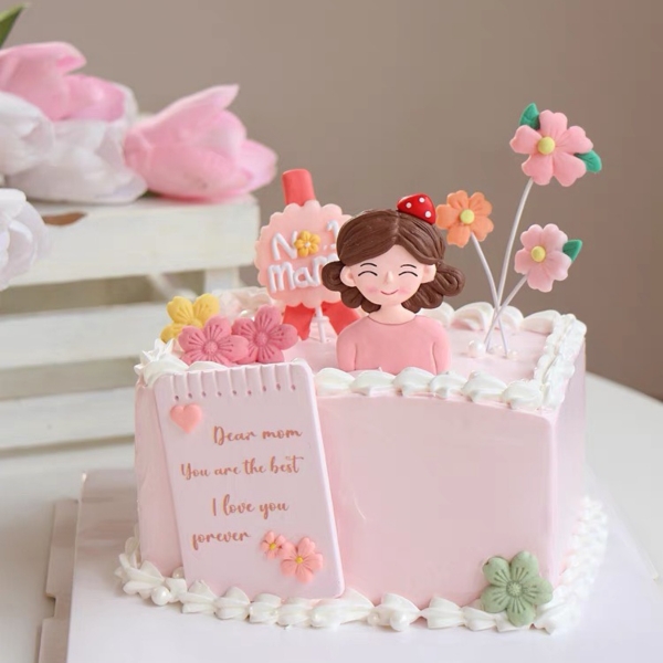 Tượng NHỰA DẺO-mẹ áo hồng mũ đỏ.