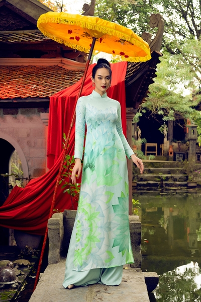 Traditional Vietnamese dress with green lotus pattern