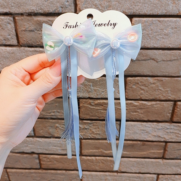Set 2 kẹp tóc nơ phối ngọc tua rua