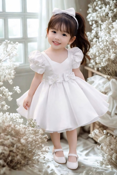 white-satin-baby-girl-princess-dress-with-puff-sleeves-pearl-neckline-and-bow-bo