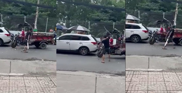 TP.HCM: Ớn lạnh hình ảnh tài xế xe ben cầm mã tấu chém xe ba gác máy