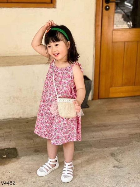 Váy 2 dây buộc nơ hoa nhí màu hồng