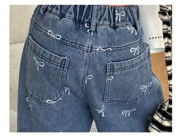 Quần jean ống loe dài họa tiết nơ size đại