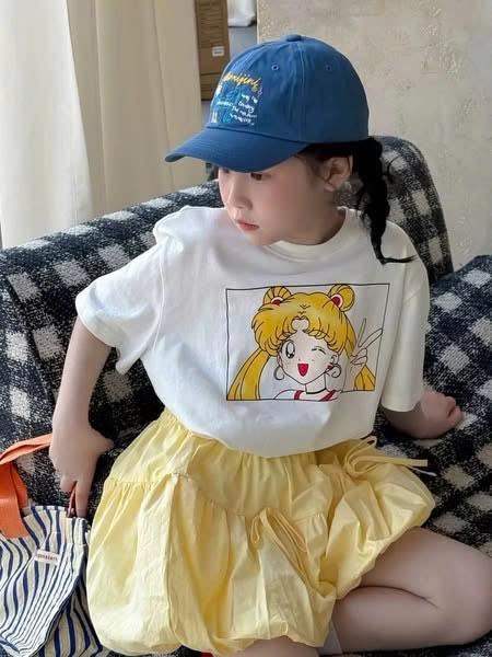 Chân váy bí màu vàng đính nơ Kumai.Kid