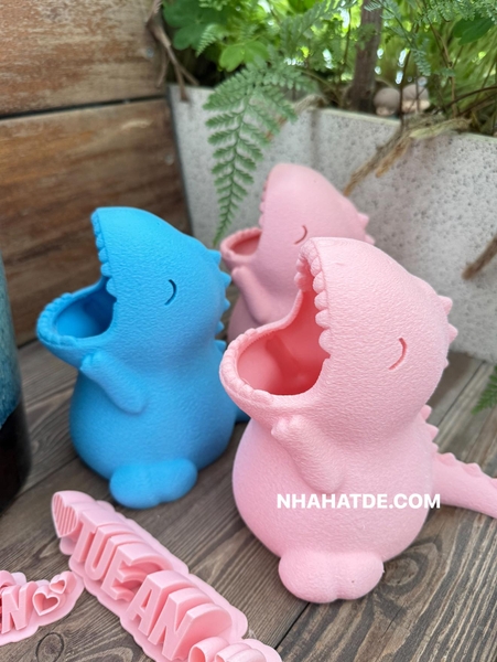 Khủng long đựng bút in 3D 2 màu xanh, hồng