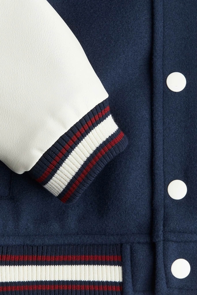 Áo khoác bomber CHICAGO H&M xanh navy phối tay da màu trắng