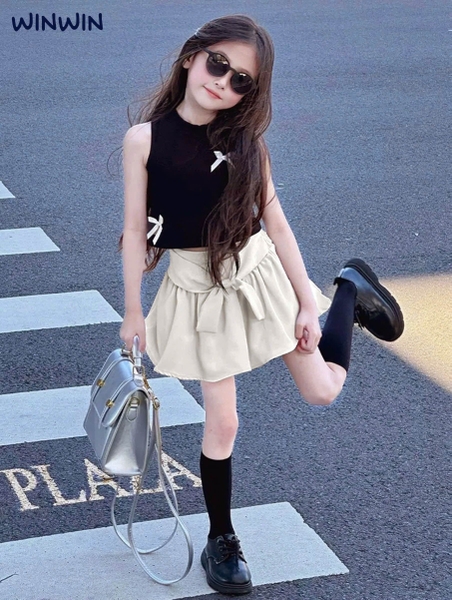 Bộ WinWin 3-8Y Nexxi áo thun sát nách croptop 2 màu hồng, đen đính nơ chân váy kate xoè