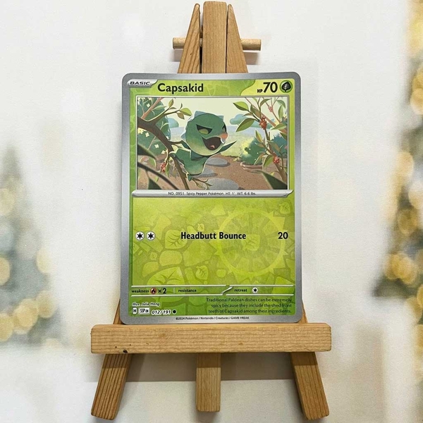 Thẻ hình Pokemon Capsakid 012/191 - Lá bài lẻ Surging Sparks Common Reverse Holo tiếng Anh chính hãng