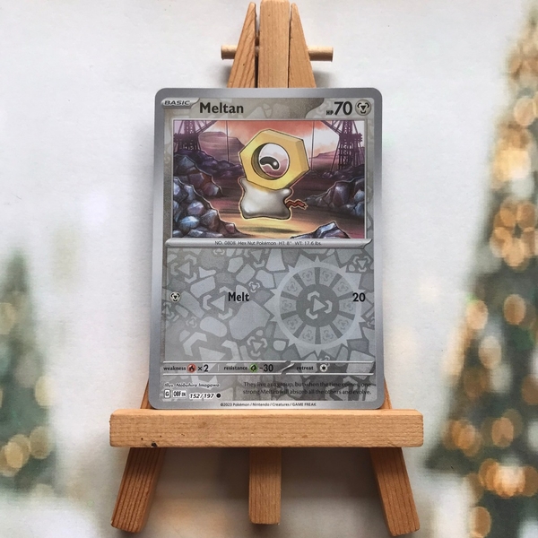 Thẻ hình Pokemon Meltan 152/197 - Lá bài lẻ Obsidian Flames Common Reverse Holo tiếng Anh chính hãng ảnh 2