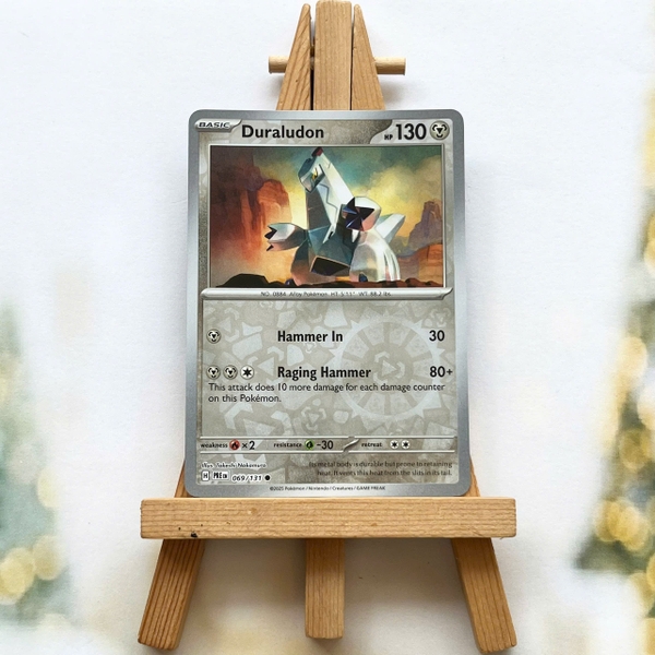 Thẻ hình Pokemon Duraludon 069/131 - Lá bài lẻ Prismatic Evolutions Common Reverse Holo tiếng Anh chính hãng ảnh 2