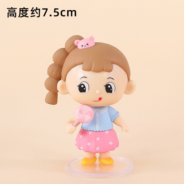 Em bé gái tóc NÂU cầm kẹo (sứ).