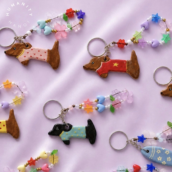 LINDO CRAFTS - Dog With Turquoise Polka Dots Shirt Ceramic Keychain