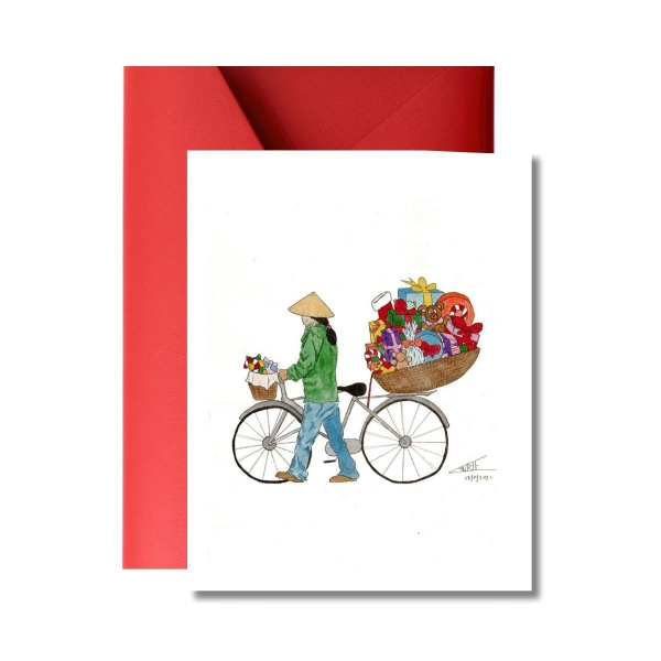 Christmas gift on Woman's Bicycle' Christmas Card by LAURIE DRAWS