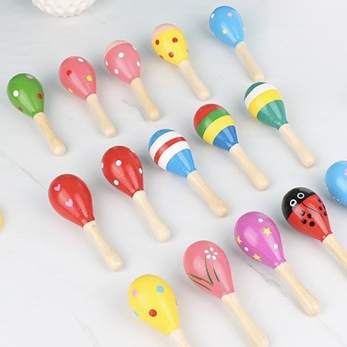 Baby Maracas Wood Toy in Yellow With Dots