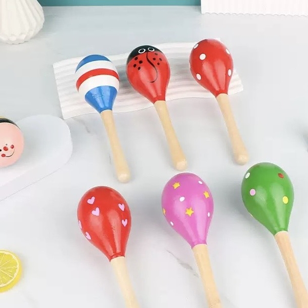 Baby Maracas Wood Toy in Green With Dots