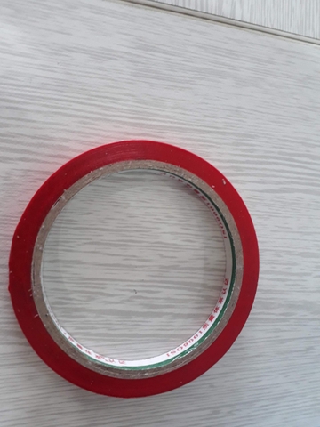 Máy buộc đầu túi, máy cột túi nilon trong siêu thị
