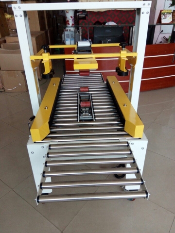 Máy dán băng dính thùng dùng loại cho thùng kích thước nặng, máy dán băng dính thùng