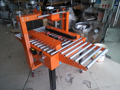 Máy dán băng dính thùng carton, máy dán băng keo thùng giấy