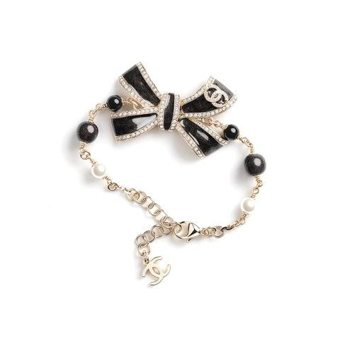 LẮC TAY CHANEL 25B NƠ VÀNG ĐEN ORNAMENT