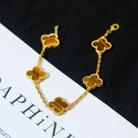 Lắc tay Van Cleef & Arpels đá mắt hổ vàng trắng 18K  (Liên hệ để biết giá)