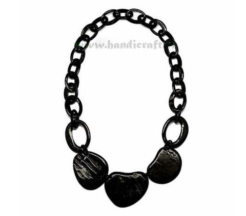Solid black horn with large pendant