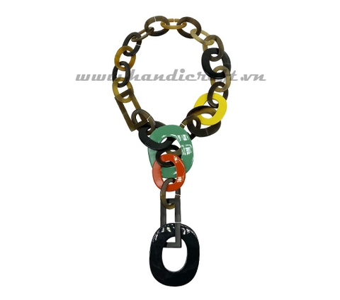 Dark horn with large pendant necklace
