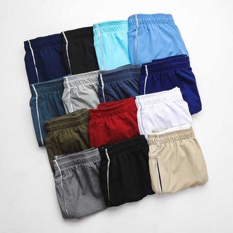 Quần thể thao CAROLLA vải dù có sọc phản quang