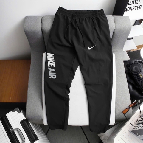 Quần dài Nike vải dù ống suông