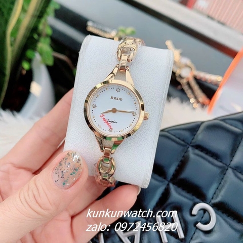 Đồng Hồ Lắc Tay Nữ Rado Điểm Pha Lê 4 Mốc Giờ Mặt Trắng Gold 26mm