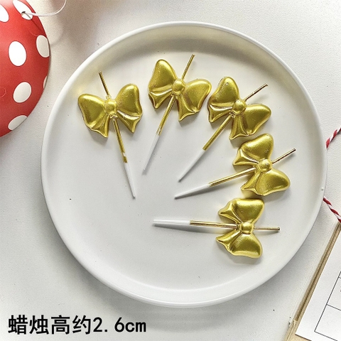 Vỉ 5 cây nến hình nơ màu VÀNG.