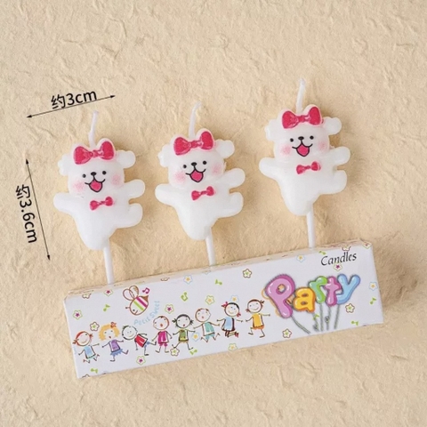 Vỉ 3 nến chó trắng đội nơ hồng.