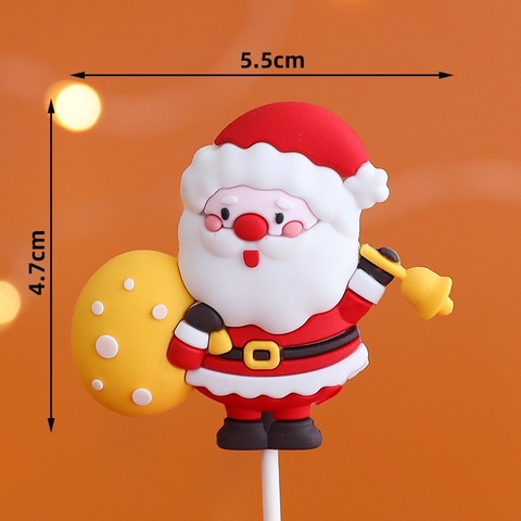 Tượng nhựa dẻo loại dày-ông già noel đeo túi quà màu vàng.