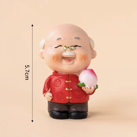 Tượng sứ -ÔNG cầm đào tiên.