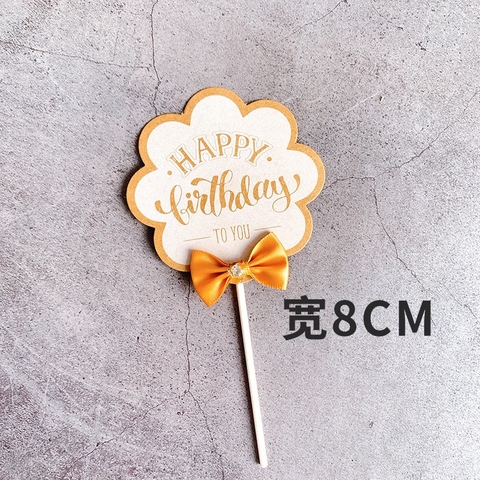 Cây cắm HPBD tròn gắn nơ vàng nâu.
